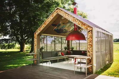 a gazebo with a couch and a table at VRBA Premium riverside mobile house BIG BERRY in Gradac