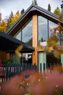 a house with a window on the side of it at Lanina Chalet Luxury Mountain Escape in Pohorje