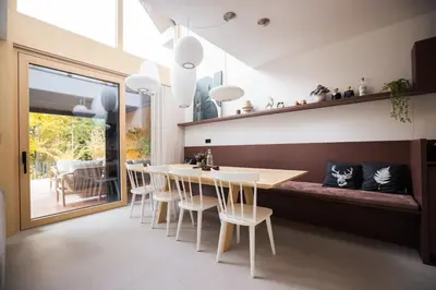 a dining room with a table and chairs at Lanina Chalet Luxury Mountain Escape in Pohorje