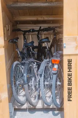 a couple of bikes parked in a garage at Cozy wabi-sabi retreat w bikes by the river in Bohinj