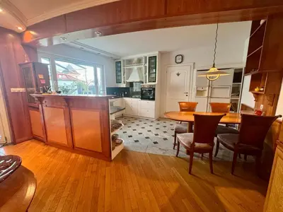 a kitchen and dining room with a table and chairs at Peaceful & Spacious Villa With A Beautiful Garden in Ljubljana