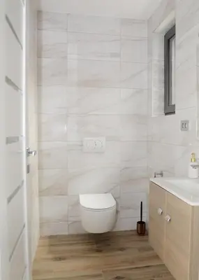 a bathroom with a toilet and a sink at Apartma Belvi in Brežice
