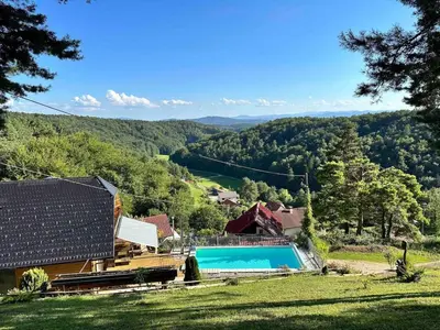 an image of a house with a swimming pool at Luxury Panorama Villa • Pool, Quadro Sauna & Views