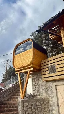 a wooden bench sitting on top of a building at Luxury Panorama Villa • Pool, Quadro Sauna & Views