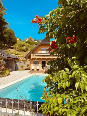 a swimming pool in front of a house at Luxury Panorama Villa • Pool, Quadro Sauna & Views
