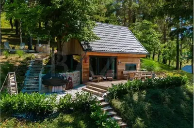 a log cabin with a porch and a patio at Secluded Romantic Cabin · Hot Tub & Barrel Sauna