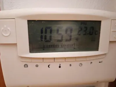 a white microwave with a clock on top of it at Boho House 6 camp Terme Catez with promotional tickets prices in Čatež ob Savi