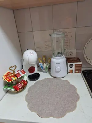 a kitchen counter with a blender and other items on it at Apartment TINA in Kranjska Gora