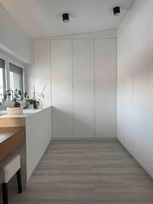 a room with white walls and a desk and a window at Cosy house with sauna and jacuzzi in Miklavž na Dravskem Polju