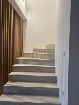 a staircase in a building with concrete steps at Cosy house with sauna and jacuzzi in Miklavž na Dravskem Polju