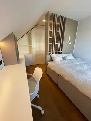 a bedroom with a bed and a desk and a chair at Lanina Estate in Spodnje Hoče