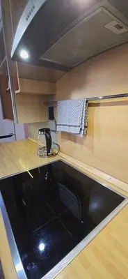 a kitchen with a black counter top and a sink at Spacious & Calm Guesthouse in Ljubljana in Ljubljana