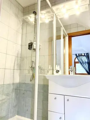 a bathroom with a shower and a sink at Mountain View House - Panoramic! in Gozd Martuljek