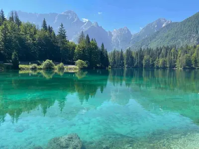 a view of a lake with mountains in the background at Mountain View House - Panoramic! in Gozd Martuljek