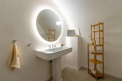 a bathroom with a sink and a mirror at Valka in Ljubljana