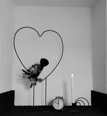 a heart with a clock in front of a wall at Peace, homeliness and wonderful memories! in Maribor
