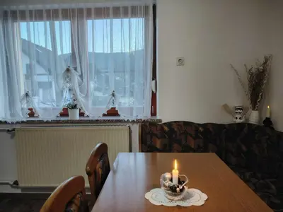 a dining room table with a candle on top of it at Peace, homeliness and wonderful memories! in Maribor
