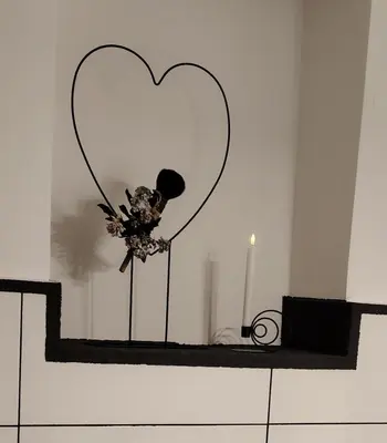a heart decoration on a shelf in a room at Peace, homeliness and wonderful memories! in Maribor