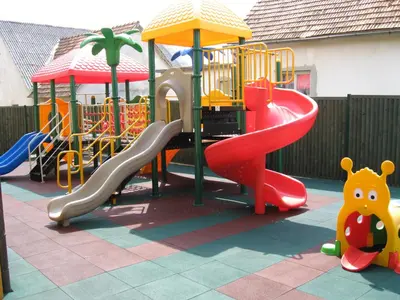 a playground with a slide at Motel Majolka in Ptuj