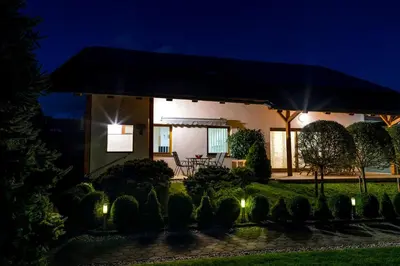 a house with a garden at night at Zimzeleni Apartments in Zreče