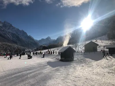 a group of people in the snow on a ski slope at Ian's Residence in Kranjska Gora