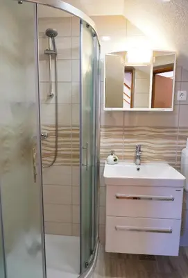 a bathroom with a shower and a sink at Apartmaji JOŠT in Bohinj