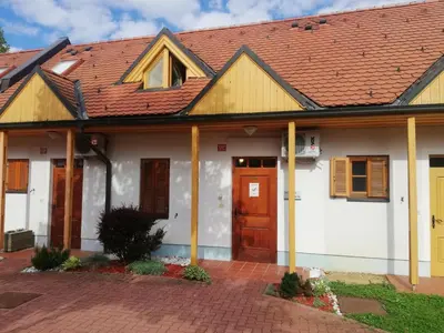 a white house with a red roof at Apartment Klas in Moravske Toplice