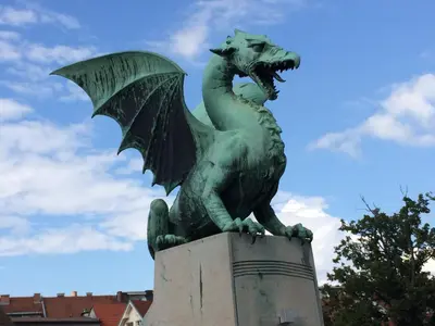 a statue of a dragon on top of a monument at Julija & Filip Apartments in Ljubljana