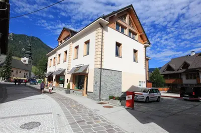 a building on the side of a street at Apartments Budinek in Kranjska Gora