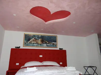 a heart on the ceiling of a bedroom at Relax Center Olimian in Podčetrtek