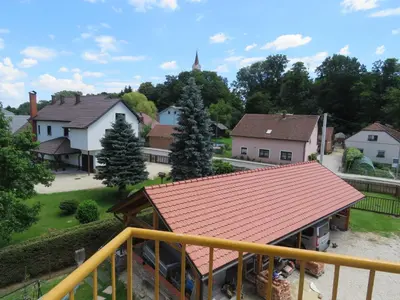 a view of a house with a red roof at Mill House Apartment and Camping in Ljutomer