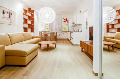 a living room with a couch and a table at WH Apartments in Ljubljana