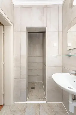 a white bathroom with a sink and a shower at APARTMENTS ROGLA JURGOVO - Ski in Ski out in Lukanja