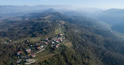 an aerial view of a village on a mountain at Vila Mravljevi Weinderer in Preserje