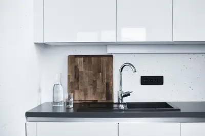 a kitchen with a sink and a counter top at Vila Mravljevi Weinderer in Preserje