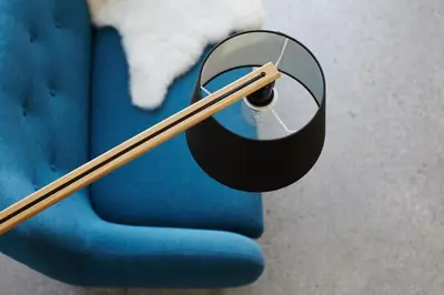 a wooden chopstick sitting on top of a blue chair at Vila Mravljevi Weinderer in Preserje