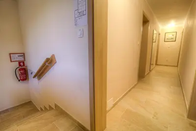 a hallway with a door and a hallwayngthngthngthngthngthngthngthngth at Dobra Hiša Zdravja Čičarija in Golac