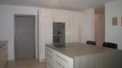 a kitchen with white cabinets and a stove top oven at Dom Vita Sticna in Ivančna Gorica