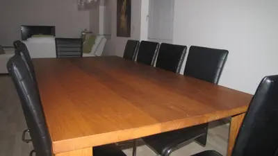 a dining room table with black chairs around it at Dom Vita Sticna in Ivančna Gorica