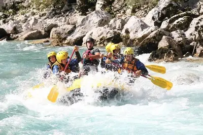a group of people are rafting on a river at Stylish Penthouse with large terrace in Most na Soči