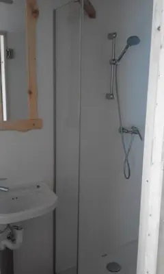 a bathroom with a shower and a sink at Guesthouse Planinski Dom Majerhold in Solčava