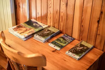 a table with four books on top of it at Farm Stay Žagar in Mozirje