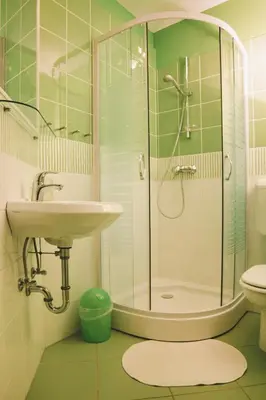 a bathroom with a glass shower and a sink at Apartments Sasha in Bled