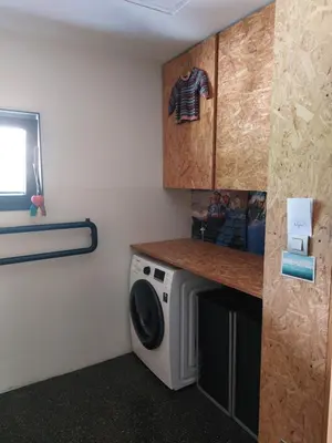 a laundry room with a washing machine in it at Holiday Home Hisa Gusta in Most na Soči