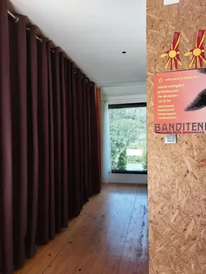a hallway with brown curtains and a window at Holiday Home Hisa Gusta in Most na Soči
