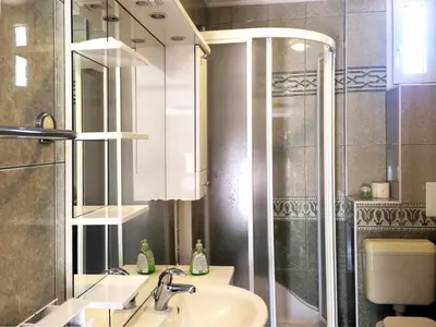a bathroom with a sink and a shower at Apartment CDR in Zreče