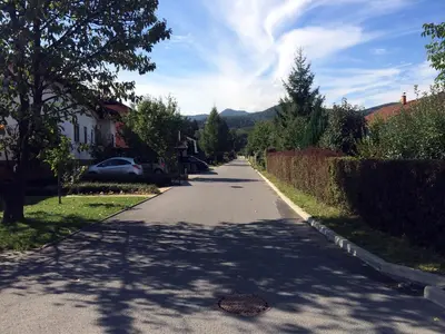 an empty street with a car parked on the side of the road at Apartment CDR in Zreče