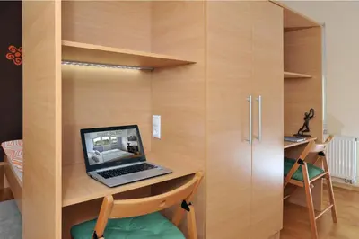 a laptop computer sitting on a desk in a room at Apartment Šilec in Šmarje pri Jelšah