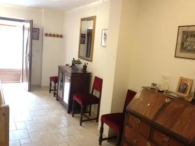 a room with chairs and a dresser and a mirror at Chalet Floranneve in Bovec