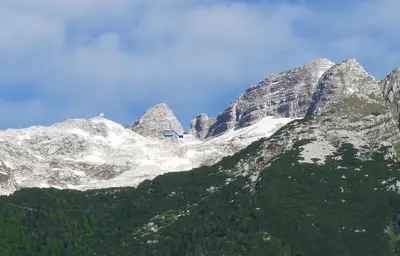 a snow covered mountain with trees on the side of it at Chalet Floranneve in Bovec